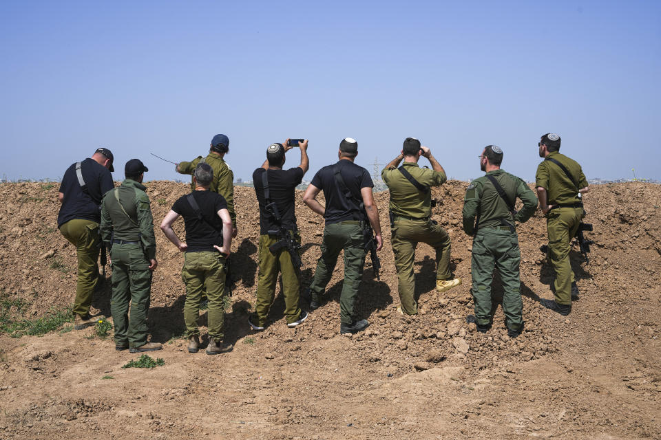 Kibbutz Kfar Azza's rapid response team watch Gaza Strip from a position on the border in southern Israel, Wednesday, April 3, 2024. (AP Photo/Tsafrir Abayov)