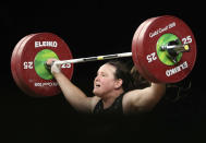 FILE - In this April 9, 2018 file photo, New Zealand's Laurel Hubbard lifts in the snatch of the women's +90kg weightlifting final at the 2018 Commonwealth Games on the Gold Coast, Australia. Hubbard will be the first transgender athlete to compete at the Olympics.Hubbard is among five athletes confirmed on New Zealand's weightlifting team for the Tokyo Games. (AP Photo/Mark Schiefelbein,File)