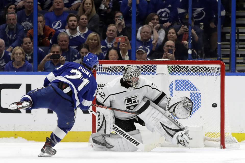 Tampa Bay Lightning center Brayden Point (21) beats Los Angeles Kings goaltender Jonathan Quick (32) during a shoot out in an NHL hockey game Tuesday, Jan. 14, 2020, in Tampa, Fla. (AP Photo/Chris O'Meara)