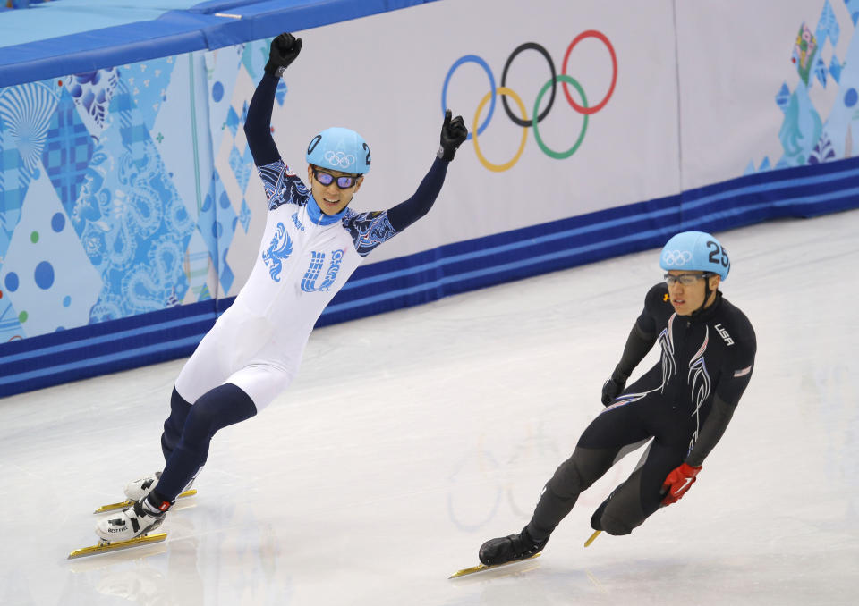 Victor An of Russia, left, celebrates winning ahead of J.R. Celski of the United States in the men's 5000m short track speedskating relay final at the Iceberg Skating Palace during the 2014 Winter Olympics, Friday, Feb. 21, 2014, in Sochi, Russia. (AP Photo/Vadim Ghirda)
