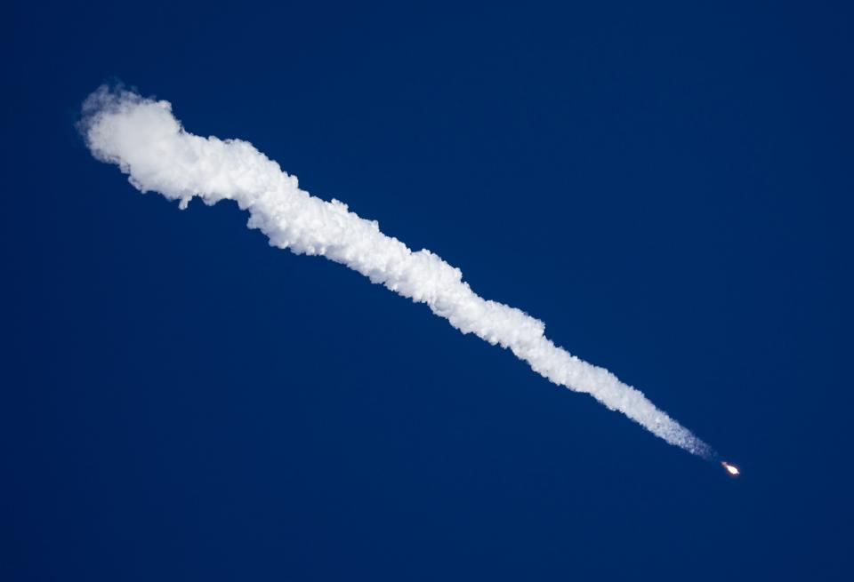 The Soyuz TMA-11M spacecraft blasts off from the launch pad at the Baikonur cosmodrome