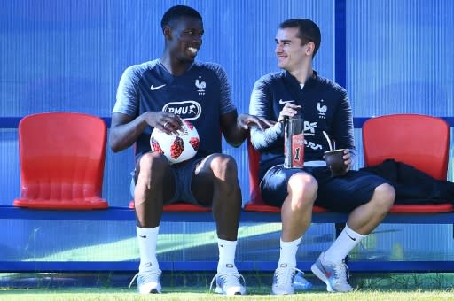 Paul Pogba and Antoine Griezmann share a joke in training ahead of the World Cup final