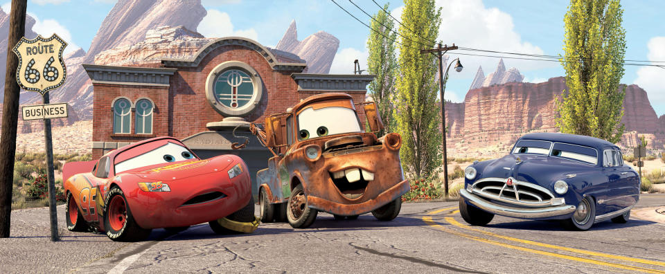 Lightening McQueen, Mater, and Doc Hudson talking