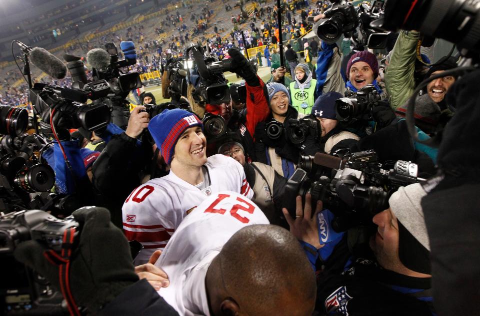 New York Giants quarterback Eli Manning leaves the field following their divisional playoff game Sunday, January 15, 2012 at Lambeau Field in Green Bay, Wis. The New York Giants beat the Green Bay Packers 37-20.