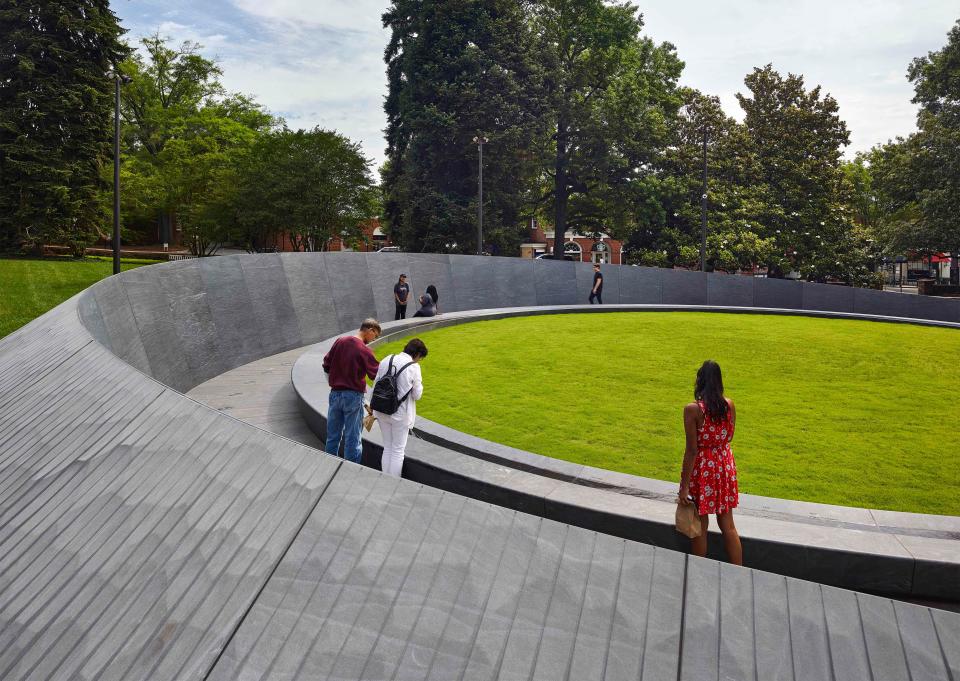 Visitors at the Memorial to Enslaved Laborers at UVA.