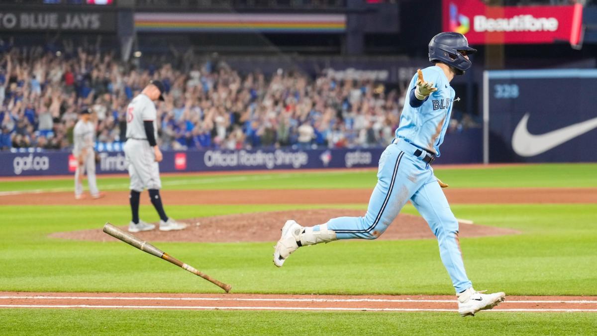 Cavan Biggio of the Toronto Blue Jays looks on from first base