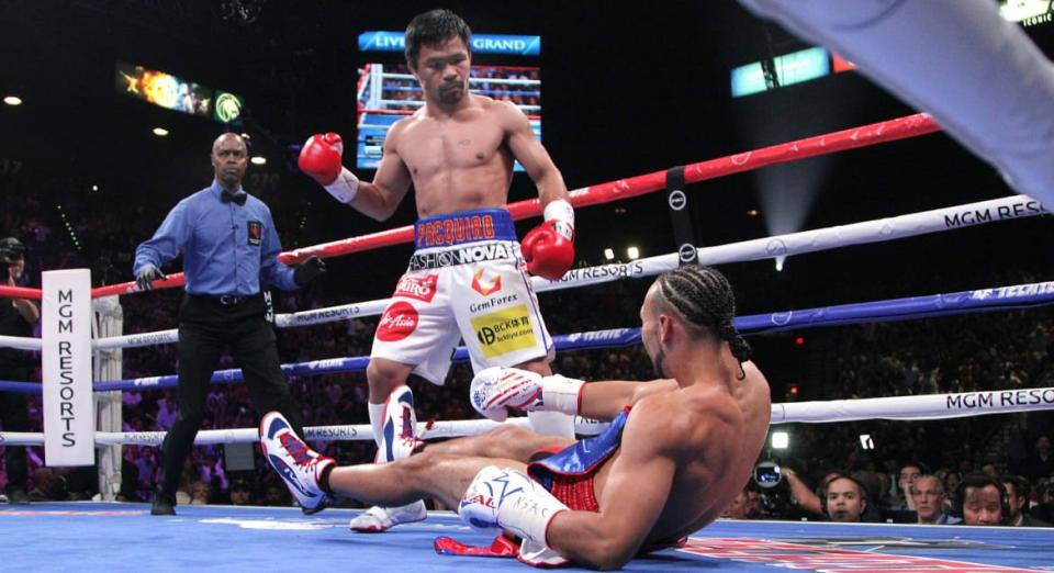 <div class="inline-image__caption"><p>Manny Pacquiao stands over Keith Thurman after sending him to the canvas during the first round of their WBA super world welterweight title fight at the MGM Grand Garden Arena on July 20, 2019, in Las Vegas, Nevada. </p></div> <div class="inline-image__credit">John Gurzinski/AFP/Getty</div>