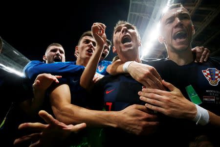 Soccer Football - World Cup - Semi Final - Croatia v England - Luzhniki Stadium, Moscow, Russia - July 11, 2018 Croatia's Mario Mandzukic celebrates scoring their second goal with teammates REUTERS/Carl Recine