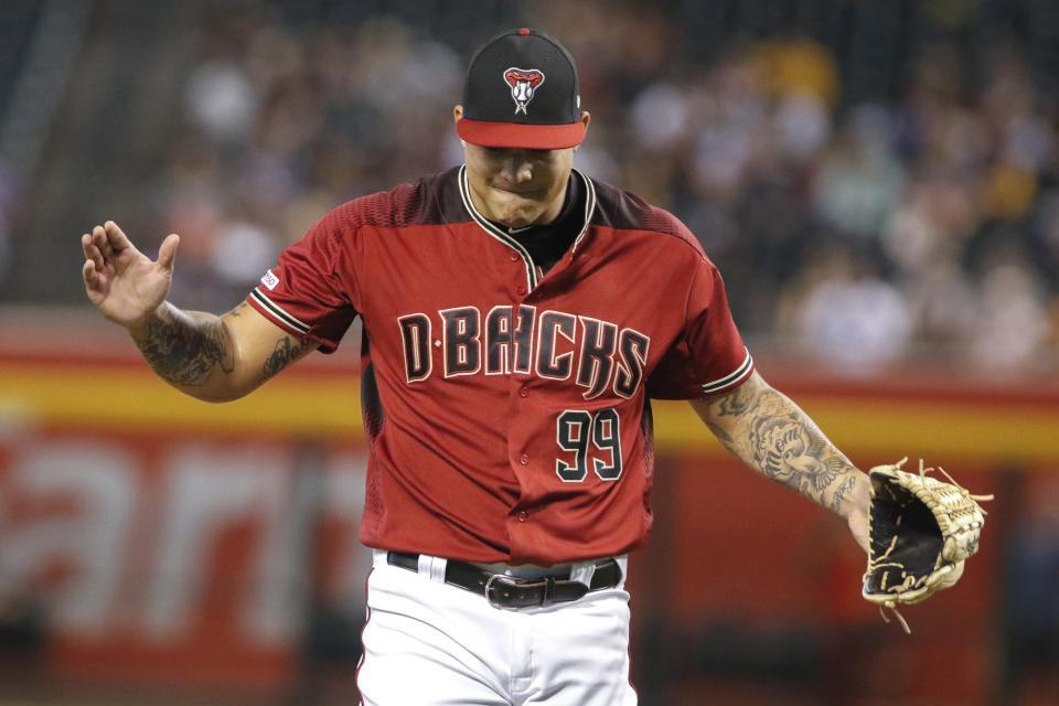 Arizona Diamondbacks' Taijuan Walker claps as he comes off the mound during the first inning of a baseball game against the San Diego Padres, Sunday, Sept. 29, 2019, in Phoenix. Walker made his first appearance on a major league mound since April 14, 2018. (AP Photo/Darryl Webb)