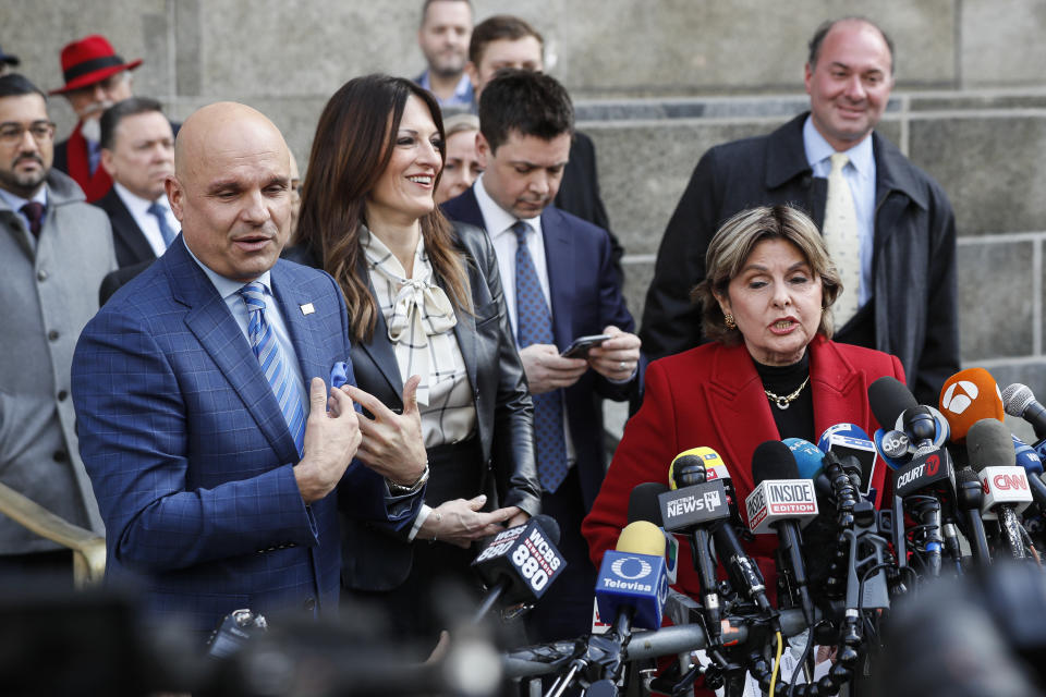 Women's rights attorney Gloria Allred, right, speaks during a press conference as Harvey Weinstein's attorneys Arthur Aidala, left, and Donna Rotunno, second from left, argue their place in line to speak outside a Manhattan courthouse after Weinstein's rape trial, Monday, Feb. 24, 2020, in New York. A jury convicted the Hollywood mogul of rape and sexual assault. The jury found him not guilty of the most serious charge, predatory sexual assault, which could have resulted in a life sentence. (AP Photo/John Minchillo)