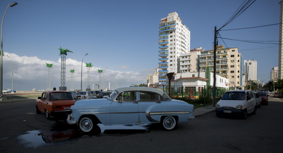 Vehicles line up outside a gas station in Havana, Cuba, Thursday, Sept. 19, 2019. A fuel shortage blamed on the Trump Administration has turned filling a tank in Cuba into an ordeal even for a country used to waiting in lines. (AP Photo/Ismael Francisco)