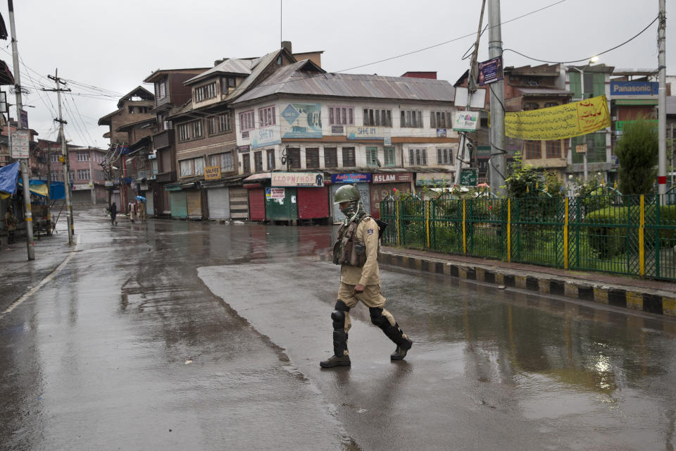 An Indian paramilitary soldier patrols during security lockdown in Srinagar, Indian controlled Kashmir, Wednesday, Aug. 14, 2019. India has maintained an unprecedented security lockdown to try to stave off a violent reaction to Kashmir's downgraded status. Protests and clashes have occurred daily, thought the curfew and communications blackout have meant the reaction is largely subdued. (AP Photo/ Dar Yasin)