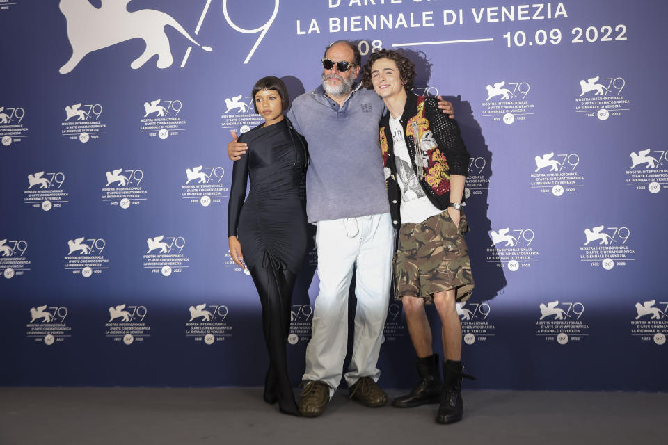 Taylor Russell, from left, director Luca Guadagnino and Timothee Chalamet pose for photographers at the photo call for the film 'Bones and All'during the 79th edition of the Venice Film Festival in Venice, Italy, Friday, Sept. 2, 2022. (Photo by Joel C Ryan/Invision/AP)