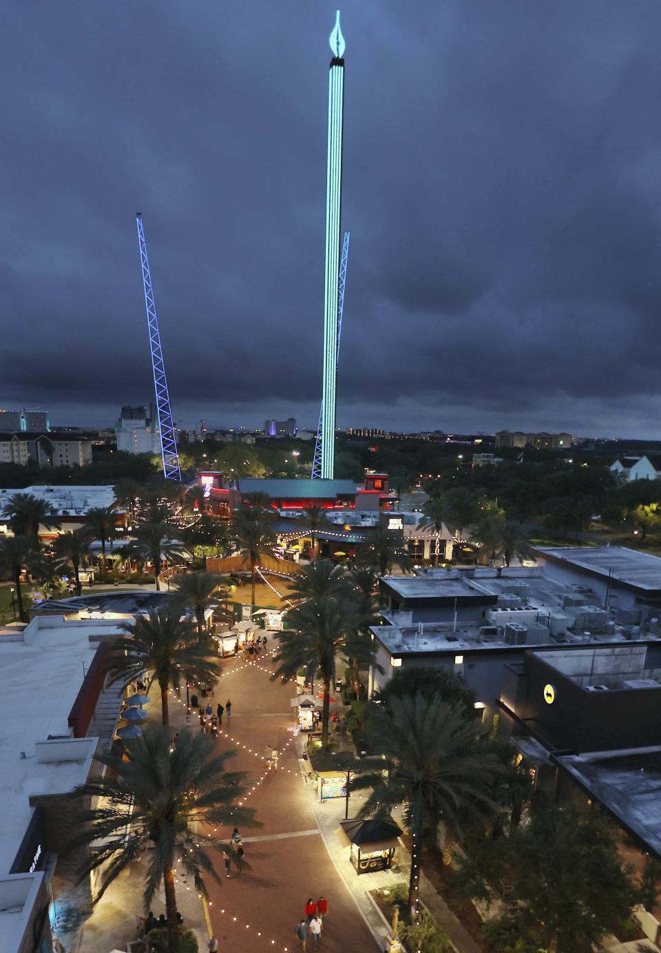 The Orlando FreeFall ride is shown at ICON Park in Orlando, Fla., on Thursday, March 24, 2022. A 14-year-old boy fell to his death from a ride at an amusement park in Orlando, sheriff's officials said. Sheriff's officials and emergency crews responded to a call late Thursday at Icon Park, which is located in the city's tourist district along International Drive. The boy fell from the Orlando Free Fall ride, which opened late last year.(Stephen M. Dowell /Orlando Sentinel via AP)