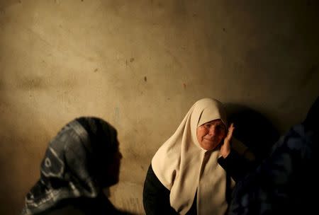 A relative of Palestinian militant Mussa Zeater, who was killed in an attack by an Israeli aircraft, mourns during his funeral in the northern Gaza Strip January 13, 2016. REUTERS/Mohammed Salem