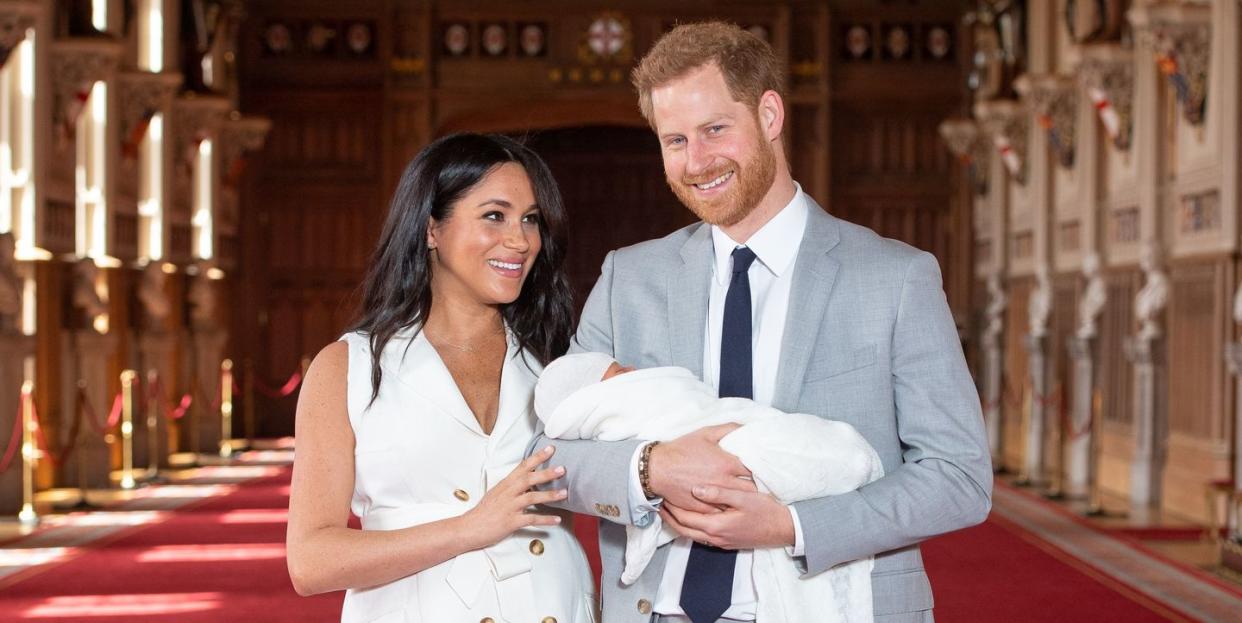 britains prince harry, duke of sussex r, and his wife meghan, duchess of sussex, pose for a photo with their newborn baby son, archie harrison mountbatten windsor, in st georges hall at windsor castle in windsor, west of london on may 8, 2019 photo by dominic lipinski pool afp photo credit should read dominic lipinskiafp via getty images