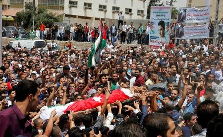 People attend the funeral of Mohammad Jawawdah in Amman, Jordan July 25, 2017. REUTERS/Muhammad Hamed