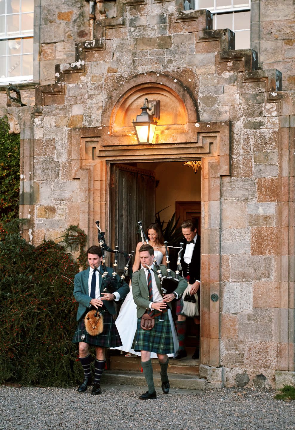 a group of people standing in front of a door