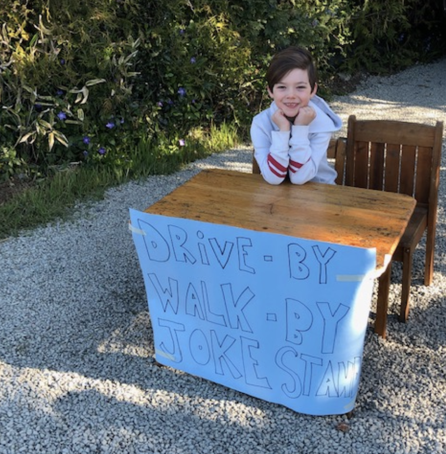 Callaghan, 6, is entertaining the neighbors with his drive-by joke stand. (Photo: Courtesy Kelsea McLaughlin)