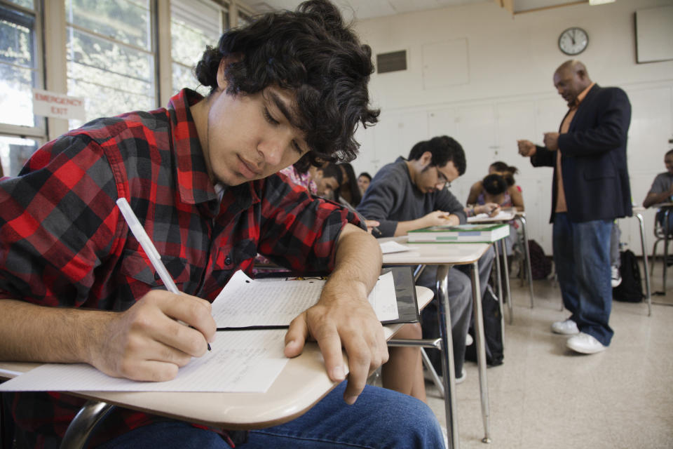 Students writing in classroom