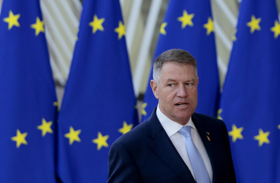 Romanian President Klaus Werner Ioannis arrives for an EU summit at the European Council building in Brussels, Friday, Feb. 21, 2020. In a second day of meetings EU leaders will continue to discuss the bloc's budget to work out Europe's spending plans for the next seven years. (AP Photo/Virginia Mayo)