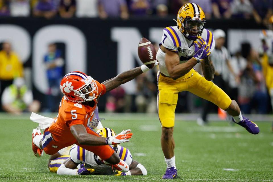 LSU safety Grant Delpit, right, breaks up a pass intended for Clemson wide receiver Tee Higgins during the first half of a NCAA College Football Playoff national championship game Monday, Jan. 13, 2020, in New Orleans. (AP Photo/Gerald Herbert)