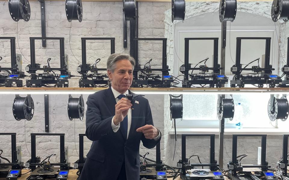 U.S. Secretary of State Antony Blinken holds a 3D-printed eagle as he visits a drone production facility, amid Russia's attack on Ukraine