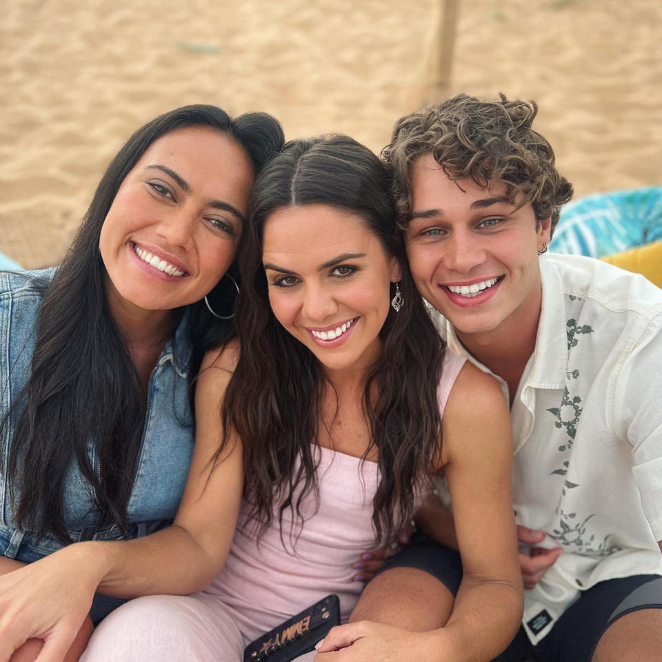 Angelina Thomson, Emily Weir and Matt Evans on the beach.