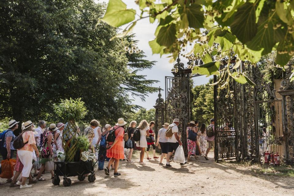 visitors with plant shopping at rhs hampton court palace garden festival 2022is