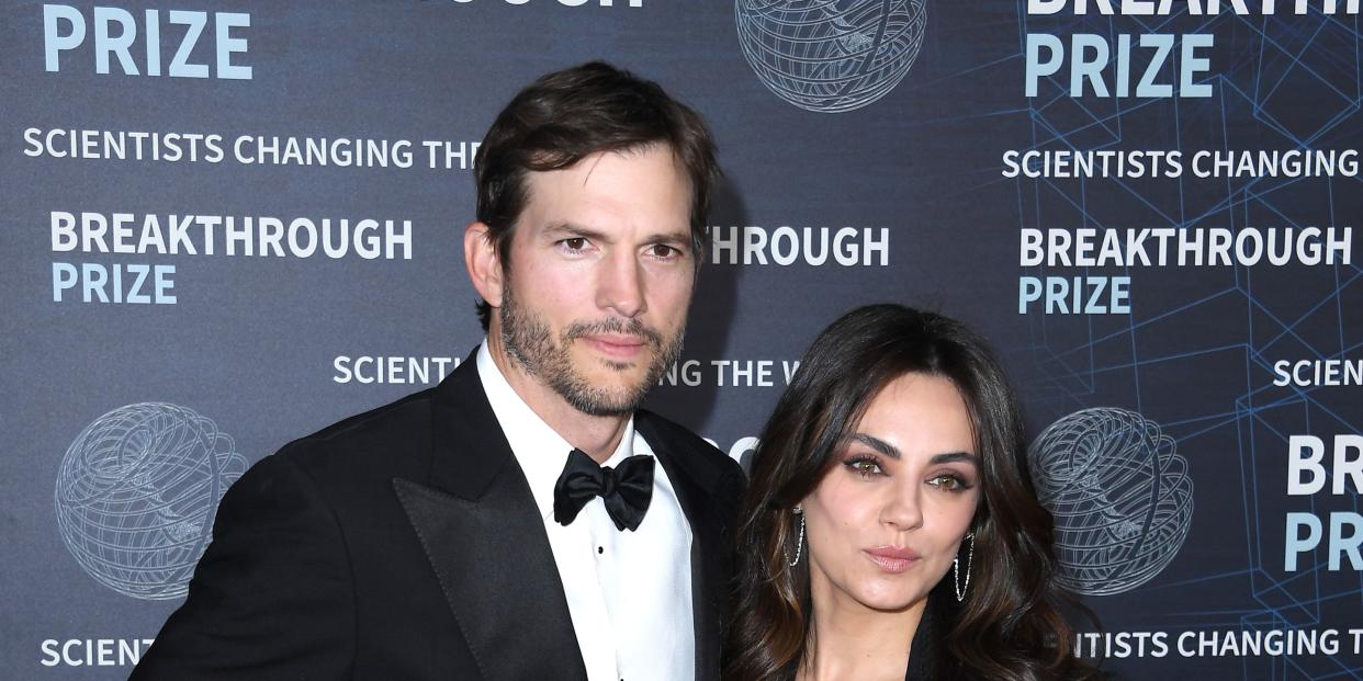 ashton kutcher and mila kunis arrive at event