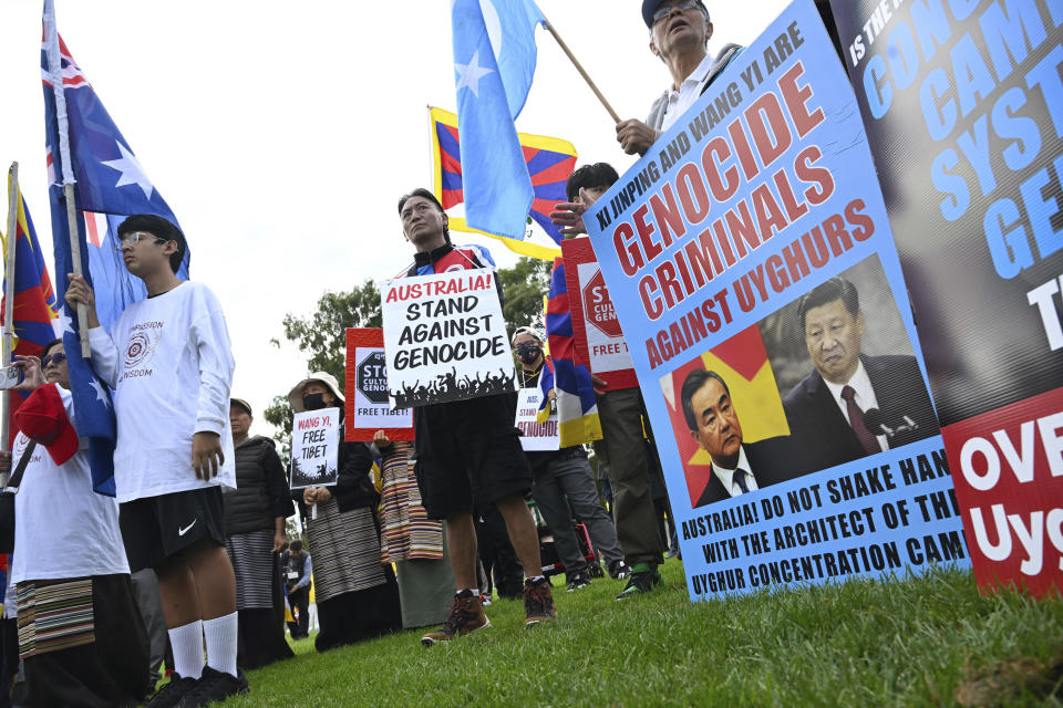 Protesters from the Free Tibet movement attend a rally organized by the Alliance for Victims of the Chinese Communist Regime at Parliament House in Canberra, Australia, where China's Foreign Minister Wang Yi met with Australia's Minister for Foreign Affairs Penny Wong, Wednesday, March 20, 2024. (Lukas Coch/AAP Image via AP)