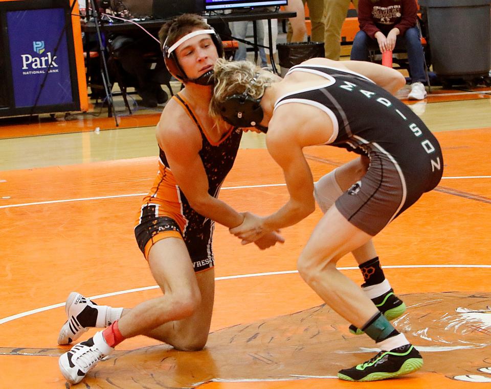 Ashland High School's Roman Parobek wrestles Madison's Michael Thomas during the JC Gorman Invitational Saturday, Jan. 8, 2022 Mansfield Senior High School. TOM E. PUSKAR/TIMES-GAZETTE.COM