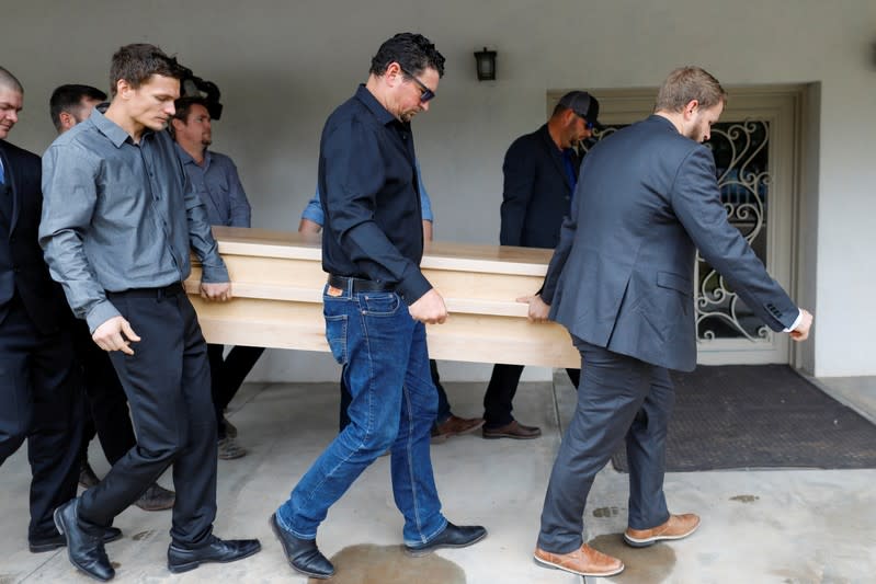 Relatives of Christina Marie Langford Johnson, who was killed by unknown assailants, carry her coffin during the funeral service before a burial at the cemetery in LeBaron, Chihuahua