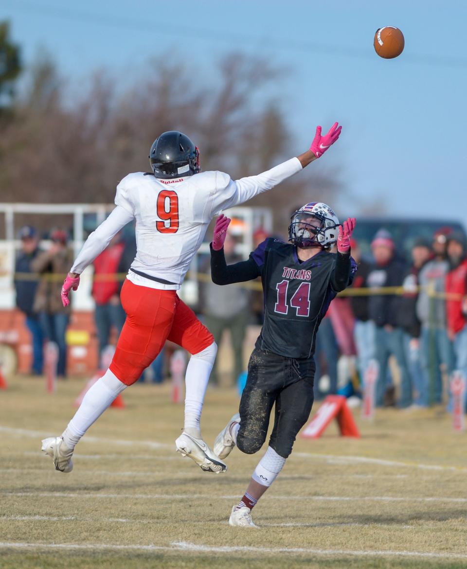 Power/Dutton/Brady's Tyler Ellsworth, 14, attempts to make a catch as Froid/Medicine Lake's Javonne Nesbit defends during the 6-player championship football game on Saturday in Dutton.