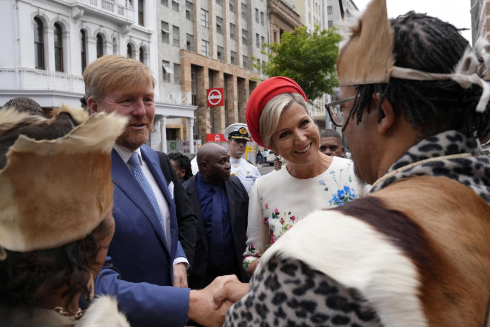 King Willem Alexander and Queen Maxima of the Netherlands arrive at the Iziko Slave Lodge museum in Cape Town during their state visit to South Africa, Friday, Oct. 20, 2023. The king and queen of the Netherlands were confronted by angry protesters in South Africa on a visit Friday to a monument that traces part of their country's involvement in slavery as a colonial power 300 years ago. (AP Photo/Nardus Engelbrecht)