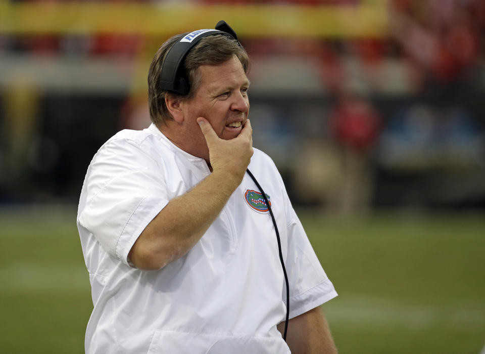 Florida head coach Jim McElwain walks the sideline in the second half of an NCAA college football game against Georgia, Saturday, Oct. 28, 2017, in Jacksonville, Fla. Georgia won 42-7. (AP Photo/John Raoux)