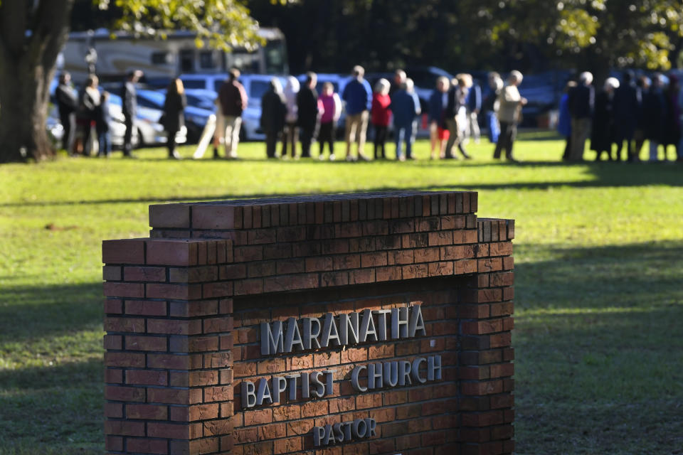 In this Nov. 3, 2019, photo, people wait in line to attend Sunday school taught by former President Jimmy Carter at Maranatha Baptist Church, in Plains, Ga. (AP Photo/John Amis)