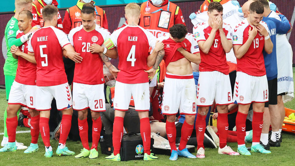 Denmark players, pictured here gathering as paramedics attend to Christian Eriksen.