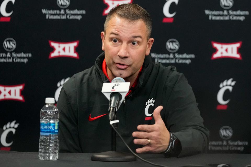 New University of Cincinnati football defensive coordinator Tyson Veidt speaks during a press conference at Fifth Third Arena in Cincinnati on Monday.