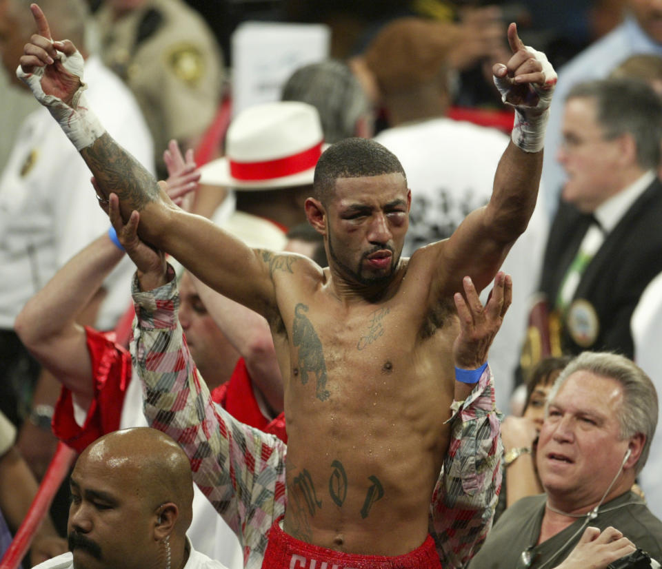 FILE - Diego Corrales, center, of Sacramento, Calif., celebrates after winning the WBC lightweight crown by defeating Jose Luis Castillo, of Mexico, May 7, 2005, at the Mandalay Bay Events Center in Las Vegas. Corrales was inducted Sunday, June 9, 2024, into the International Boxing Hall of Fame during a ceremony at the Turning Stone Resort Casino in Verona, N.Y. (AP Photo/Matthew Minard, File)