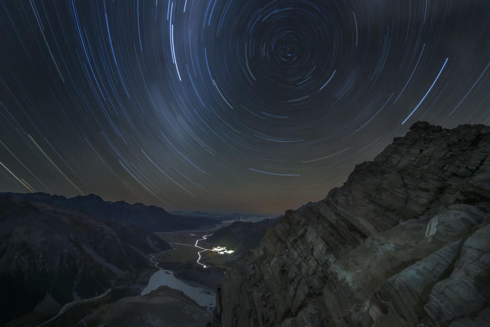 <p>Star trails swirl across the New Zealand sky in this long-exposure shot taken from Sefton Bivouac, the oldest hut in Mount Cook National Park. (Lee Cook)</p>