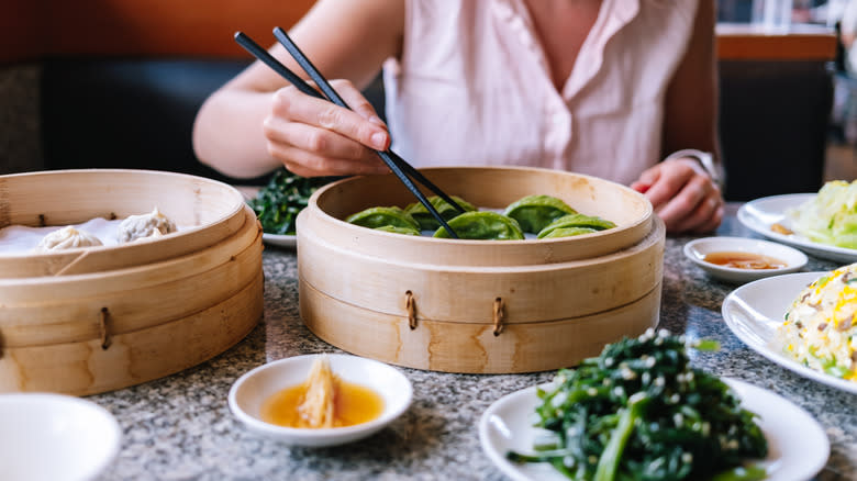 Person eating in Chinese restaurant 