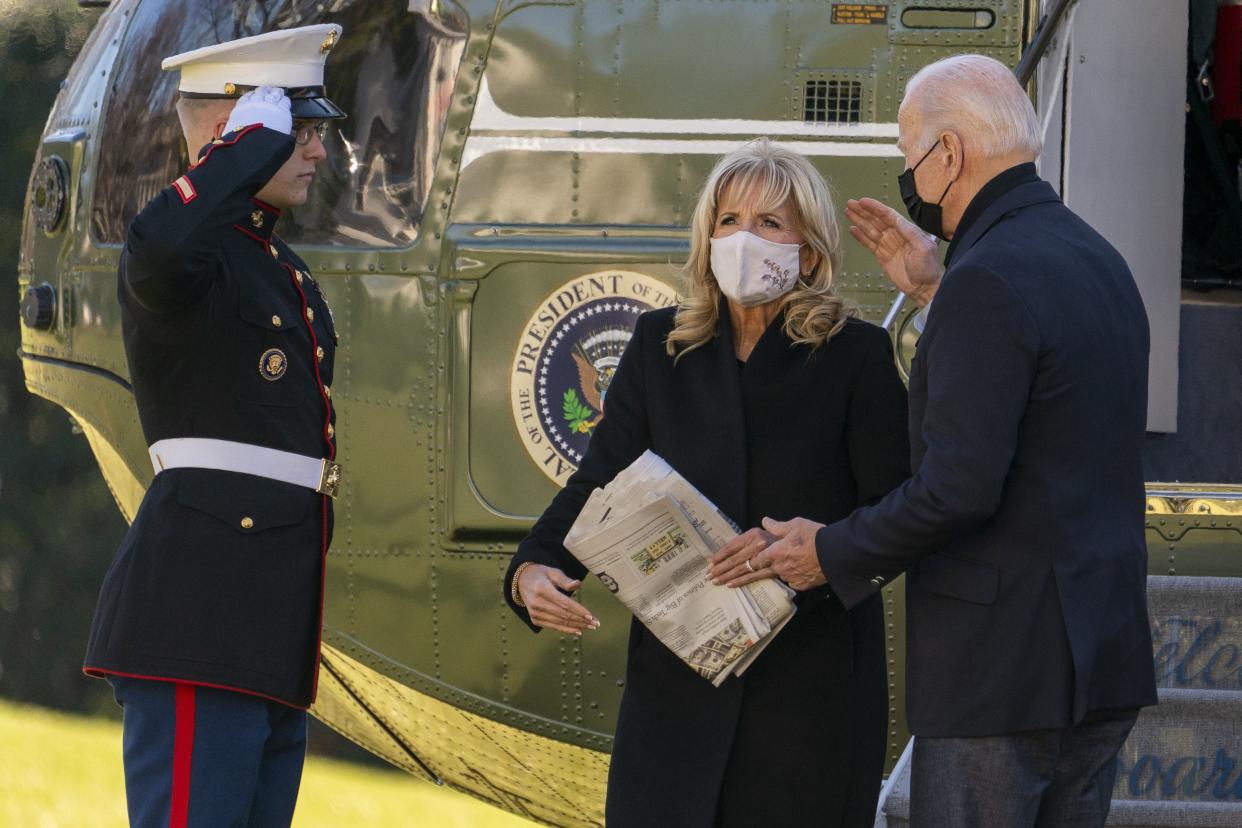 President Joe Biden and first lady Jill Biden arrive at the White House in Washington, Sunday, Dec. 12, 2021, after spending the weekend in Wilmington, Del.