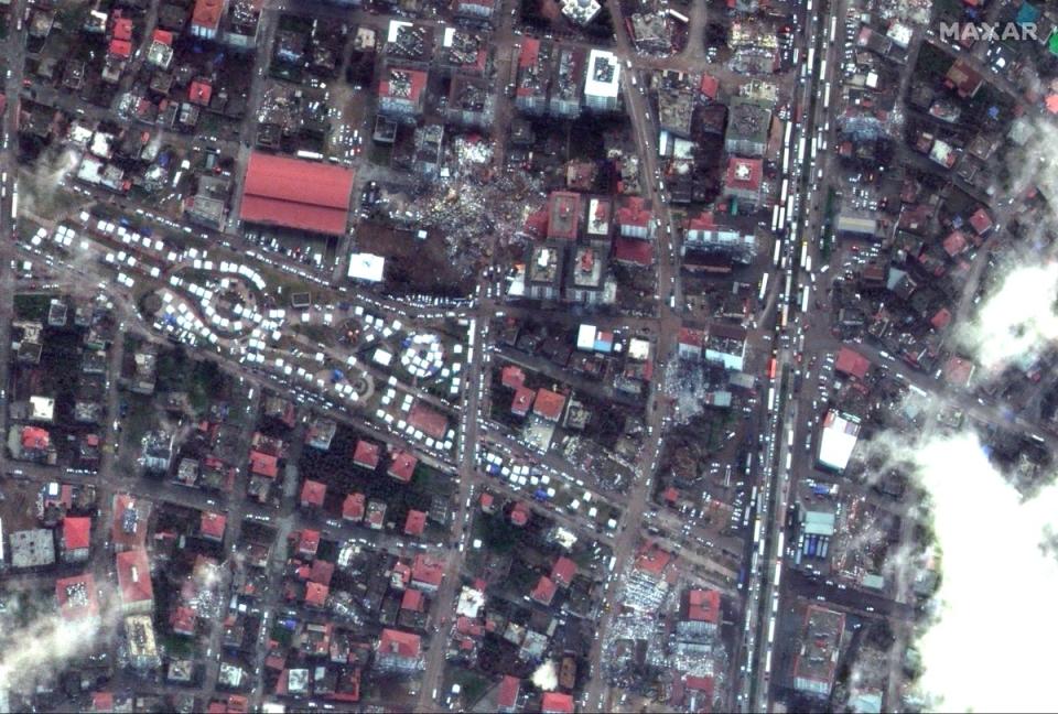 White emergency tents and damaged buildings Nurdagi, Turkey 7 Ferbuary 2023. (Satellite image ©2023 Maxar Technologies.)