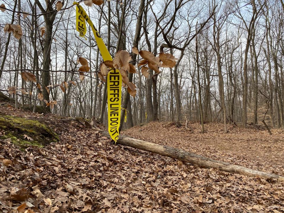 Saturday afternoon broken sheriff’s yellow tape could be seen still tied to trees on a path less half mile from a rear parking area on Crest Drive on the reservation.
