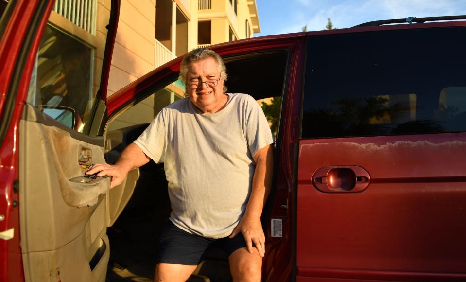 Thomas Sosnowski poses for a photo with his 2003 Honda Odyssey in Venice.  The minivan recently needed repairs  he could not afford, leaving him with no way to get to doctor appointments or buy groceries.  Season of Sharing stepped in and helped him get the vehicle repaired. 