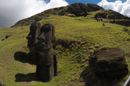 Statues named "Moai" are seen on a hill at the Easter Island, Chile February 1, 2019. Picture taken February 1, 2019. REUTERS/Jorge Vega
