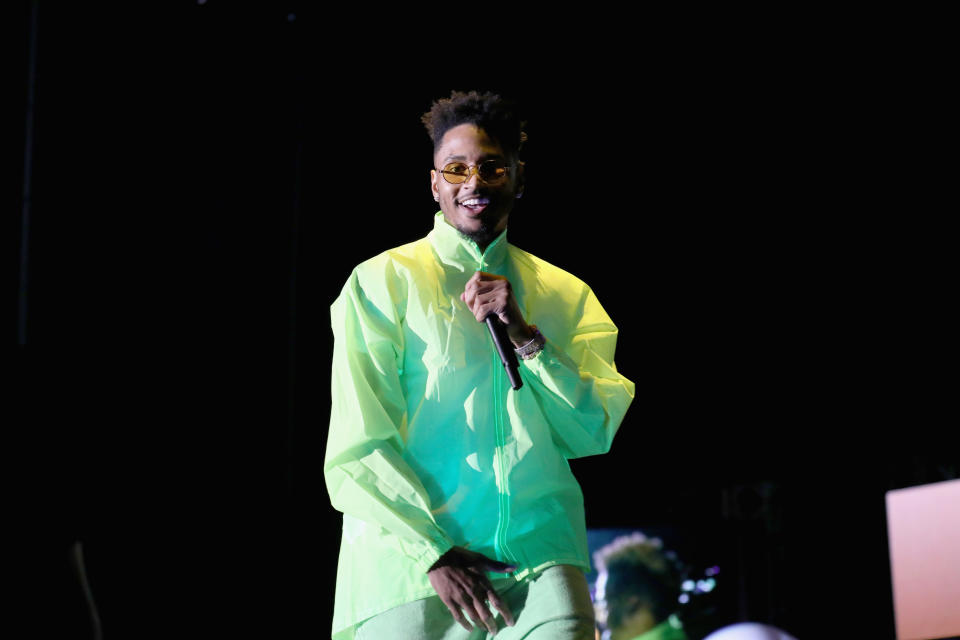 Trey Songz performing wearing all green