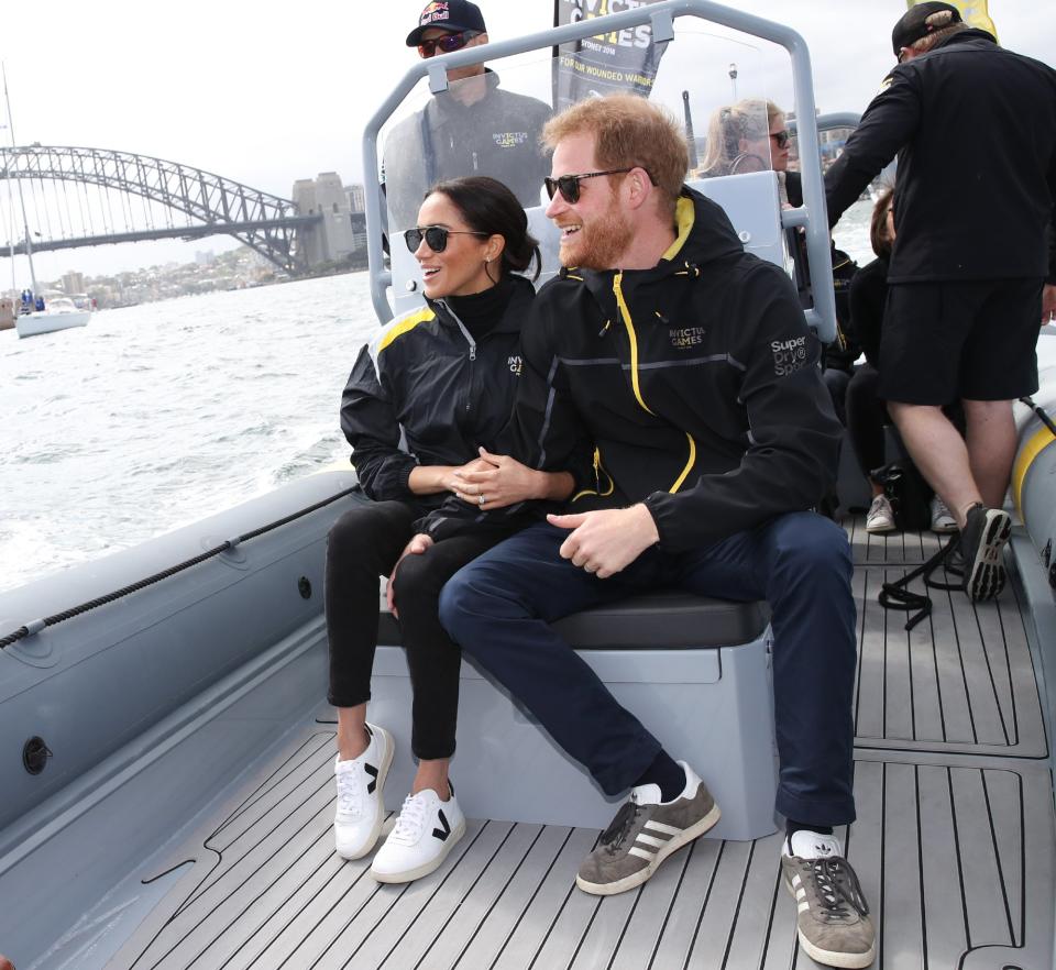 Meghan <a rel="nofollow noopener" href="https://people.com/royals/meghan-markle-wears-sneakers-royal-appearance-first-time/" target="_blank" data-ylk="slk:showed off her sporty side;elm:context_link;itc:0;sec:content-canvas" class="link ">showed off her sporty side</a> while watching sailers compete in the 2018 Invictus Games in Sydney. 