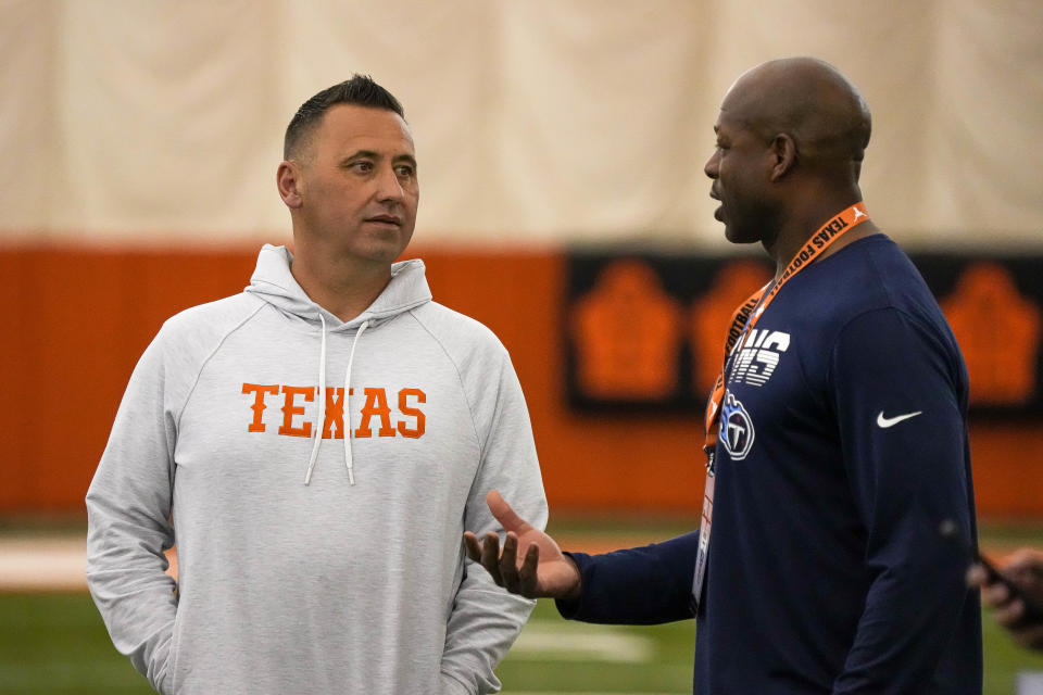 Head coach Steve Sarkisian, left, talks to Tony Dews of the <a class="link " href="https://sports.yahoo.com/nfl/teams/tennessee/" data-i13n="sec:content-canvas;subsec:anchor_text;elm:context_link" data-ylk="slk:Tennessee Titans;sec:content-canvas;subsec:anchor_text;elm:context_link;itc:0">Tennessee Titans</a> at the Texas Longhorns’ annual pro timing day at Denius Fields on the Universiy of Texas at Austin Campus on Thursday March 9, 2023.